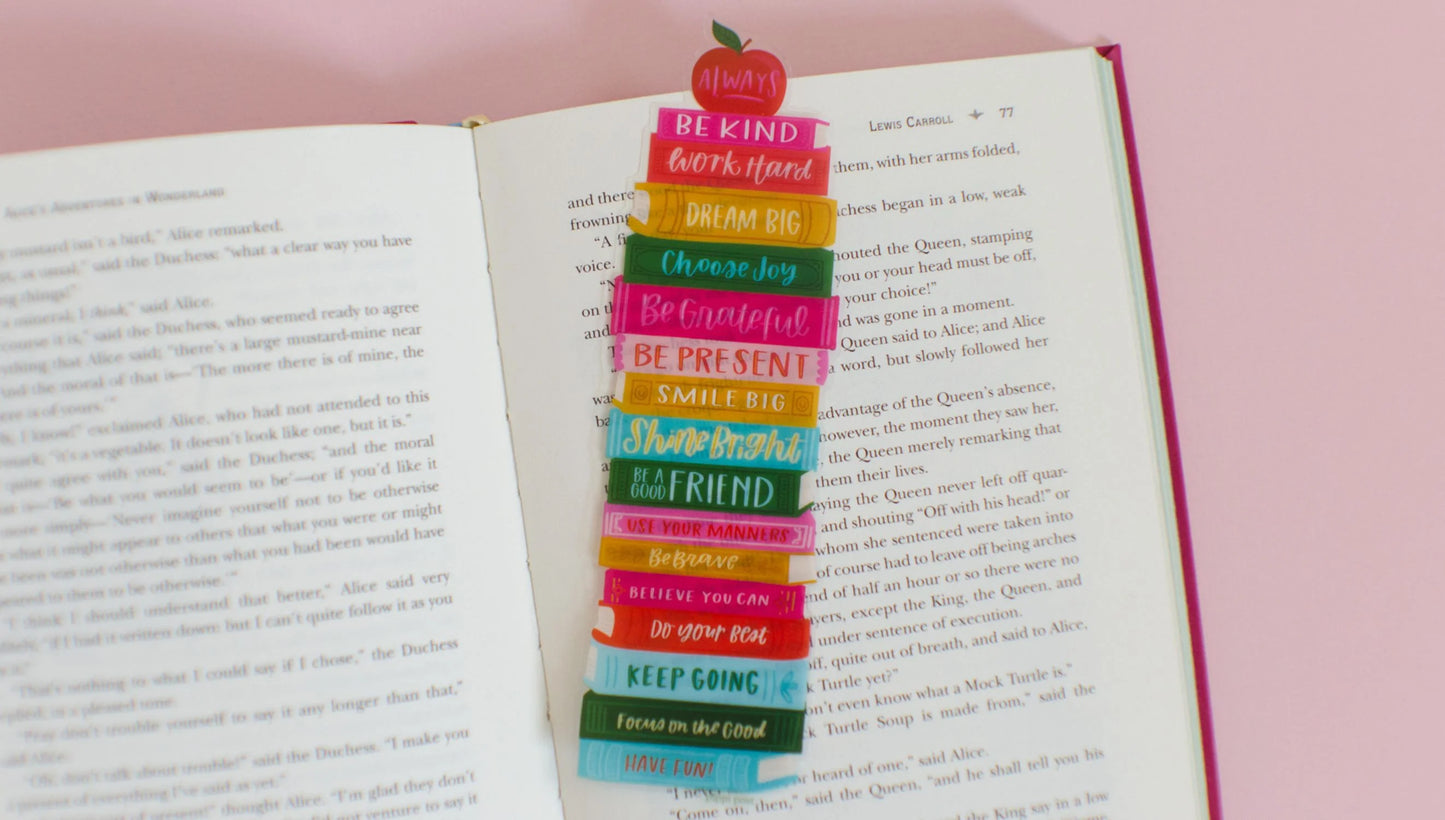 Affirmations Book Stack Transparent Bookmark laying on an open book