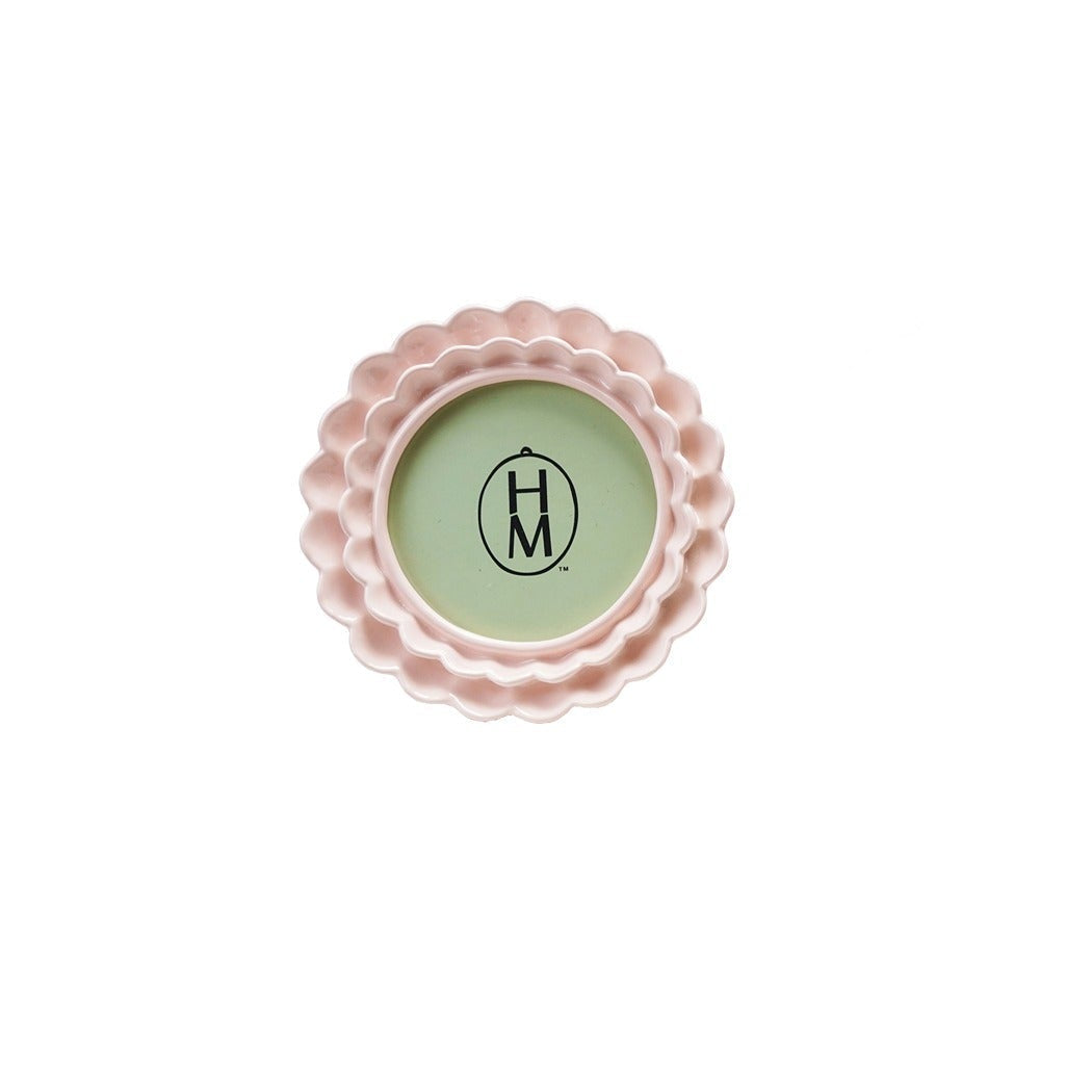 round pale pink frame with a double ruffle design shown on a white background