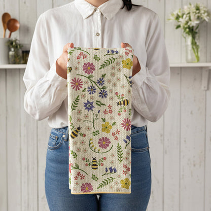 bee garden towel being held by a person wearing jeans and white blouse