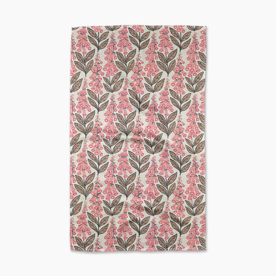 tan towel with pink foxglove flowers on it