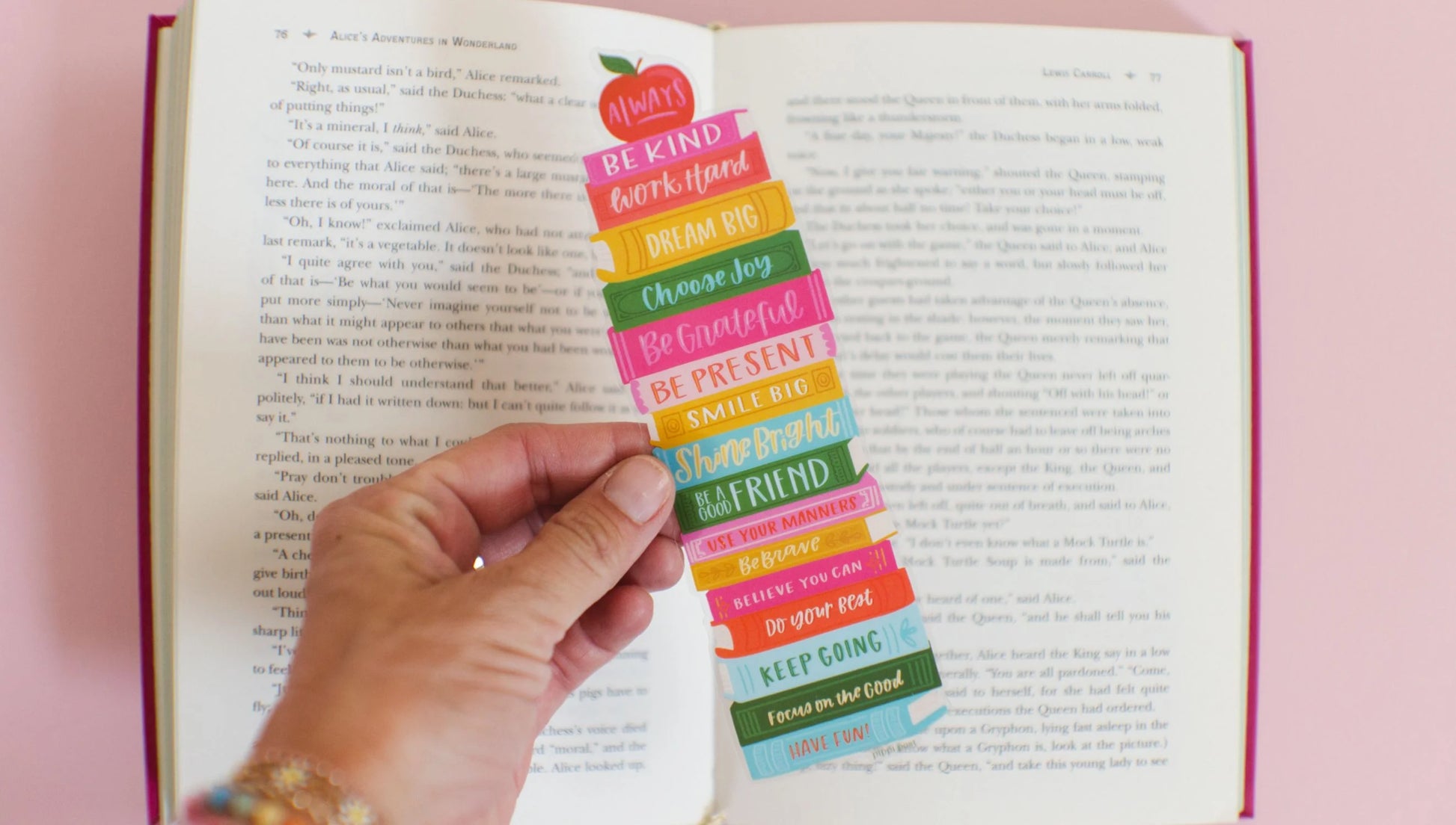 hand holding Affirmations Book Stack Transparent Bookmark