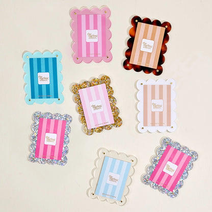assorted Mini Acrylic Frame Magnets arranged on a beige background
