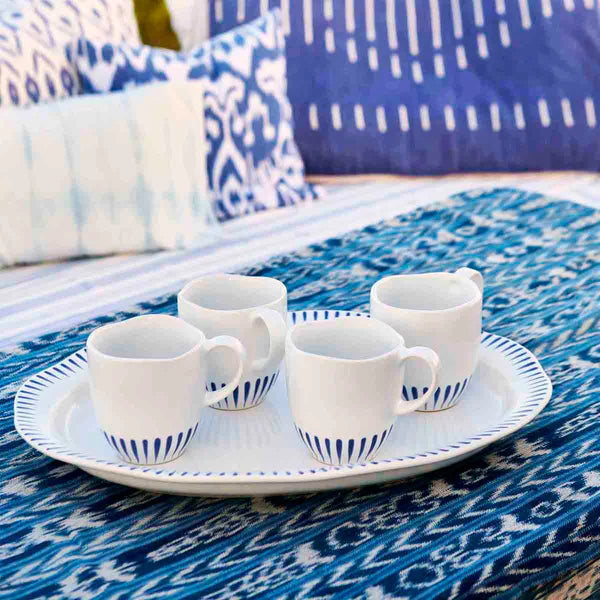 4 Sitio Stripe Delft Blue mugs on a tray on a table