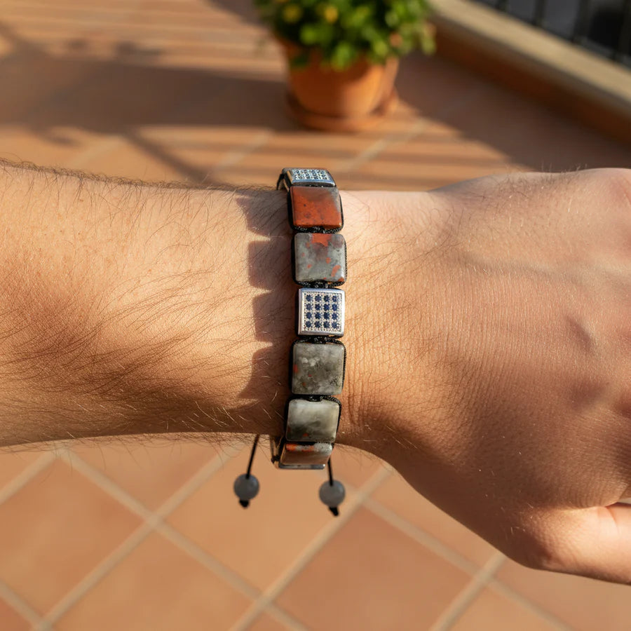 Bracelet on a wrist with a blurred outdoor background