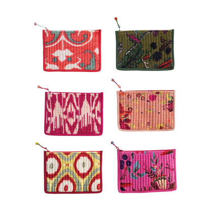 six assorted colorful patterned pouches on a white background