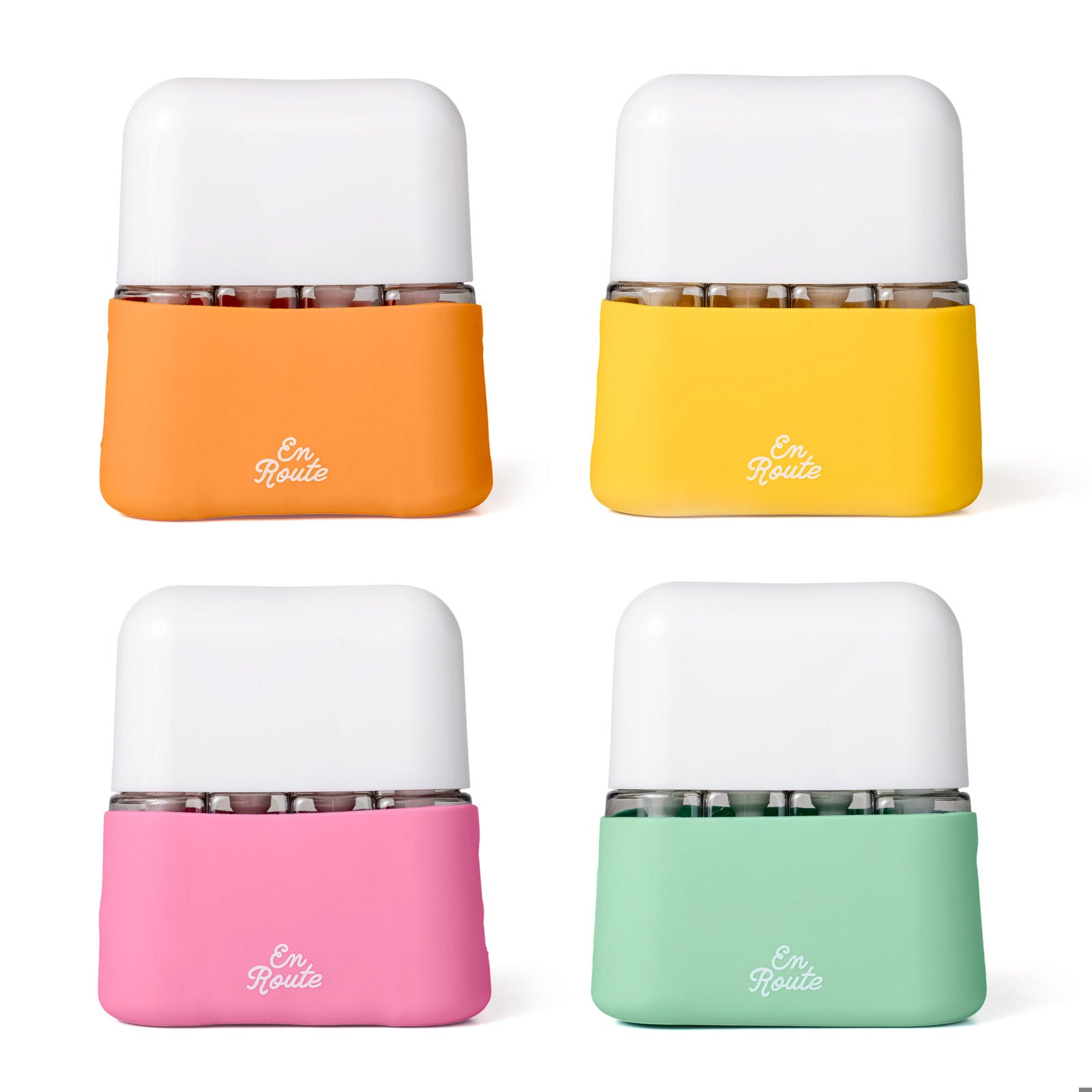 Bon Voyage Travel Bottle Set in 4 colors: orange, yellow, pink, teal arranged on a white background