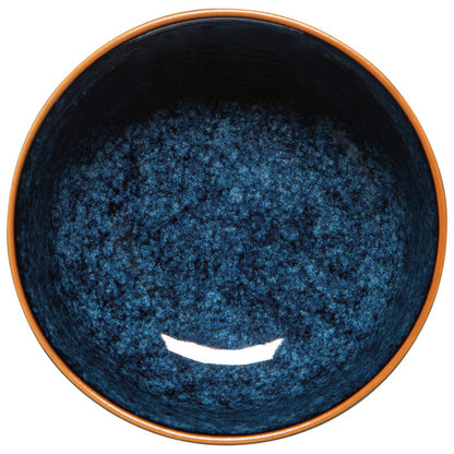 top view of Blue ceramic bowl with brown rim on white background