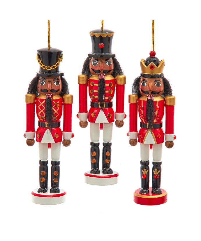 all three styles of red and white uniformed nutcracker ornaments displayed against a white background