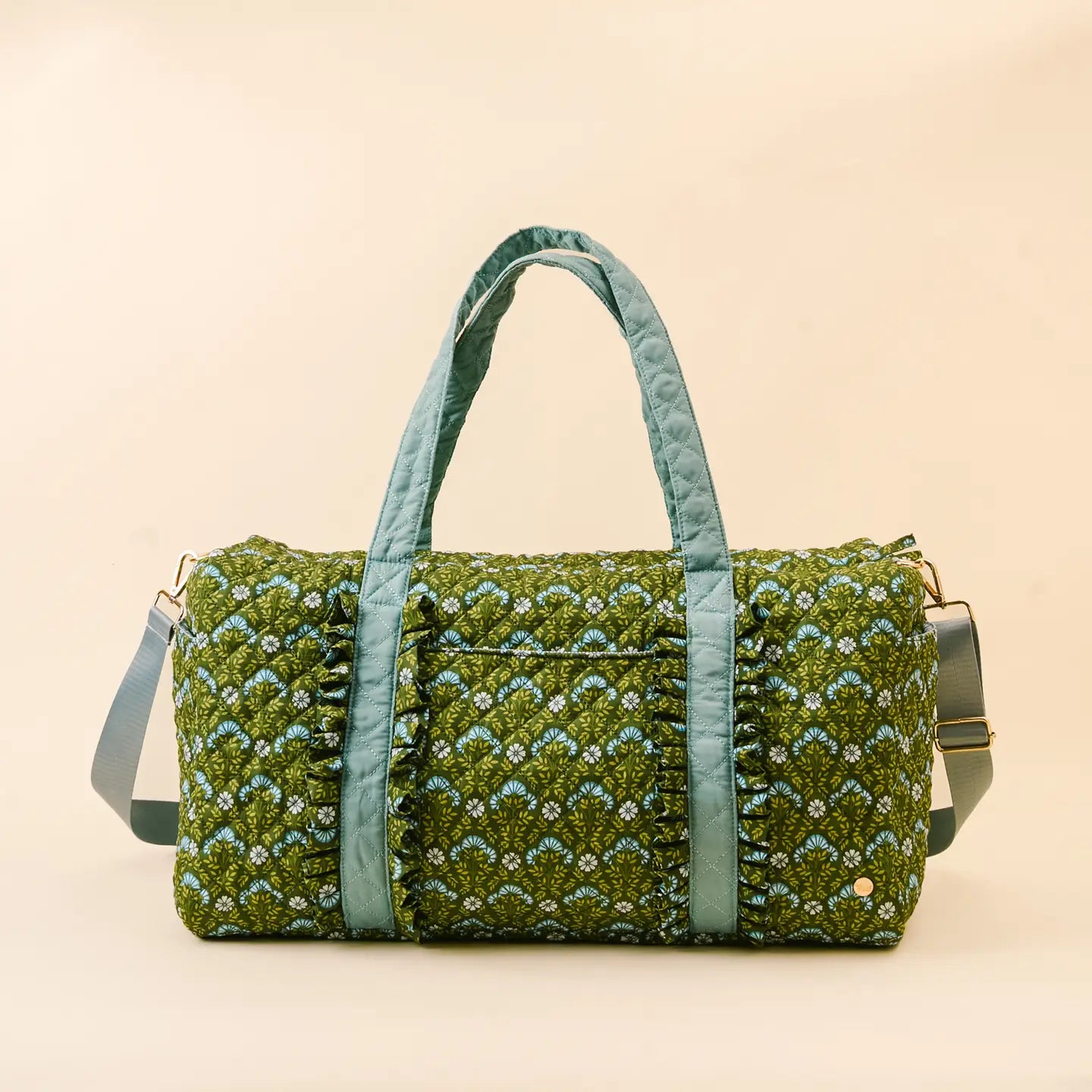 Everbloom Forest Green weekender bag shown on a beige background