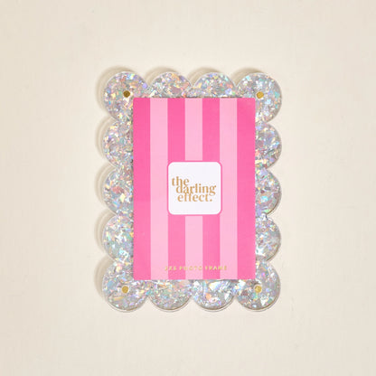 Scalloped silver confetti magnetic frame on a white background.