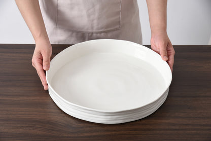 person holding the Le Blanc round serving platter