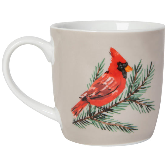 other side of White mug with red cardinal and green branch design 