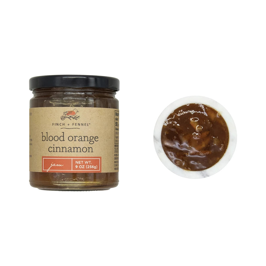 Jar of 'blood orange cinnamon' with a close-up of the product on a white background