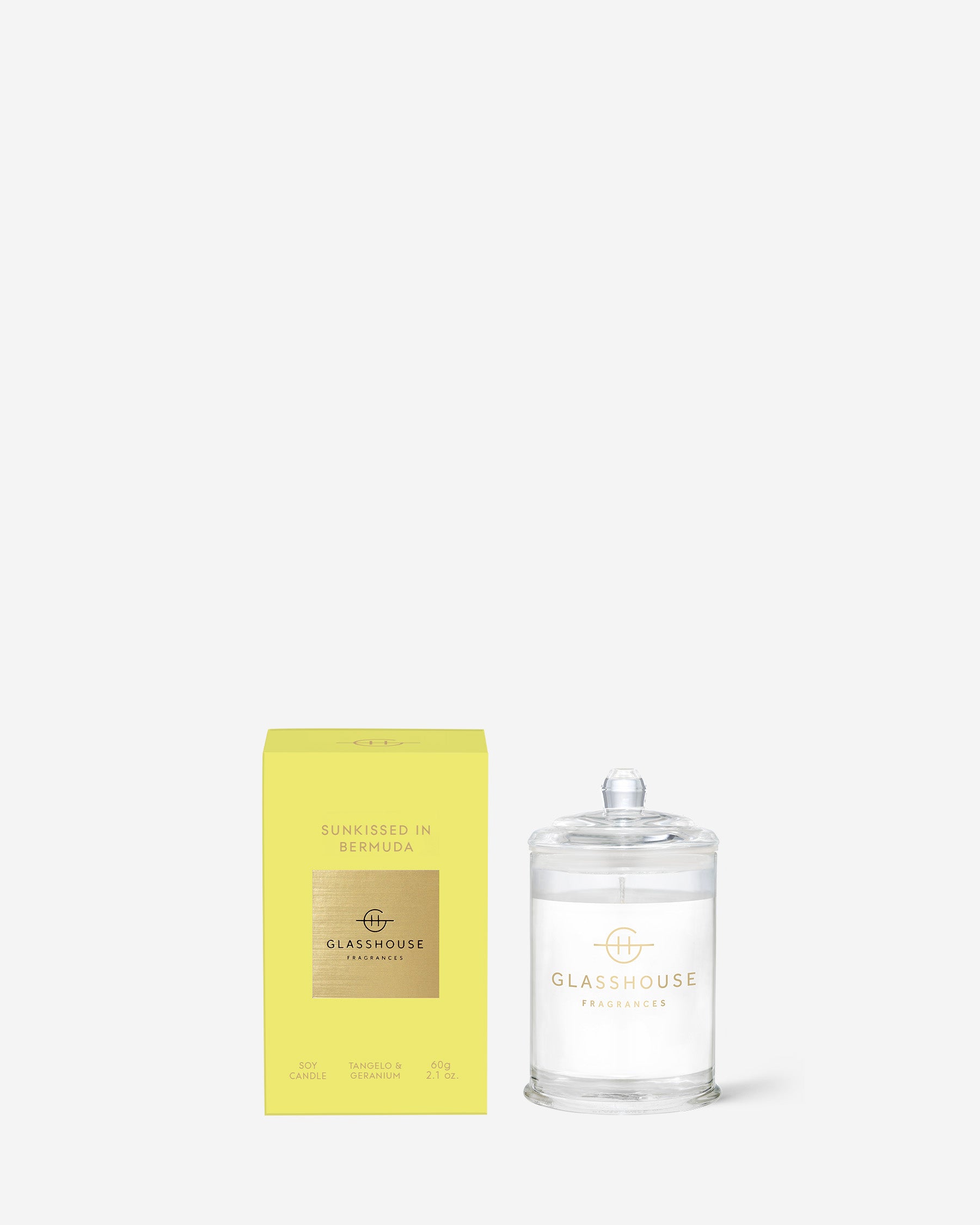  Sunkissed In Bermuda Triple Scented Small Candle in glass vessel set next to its yellow box