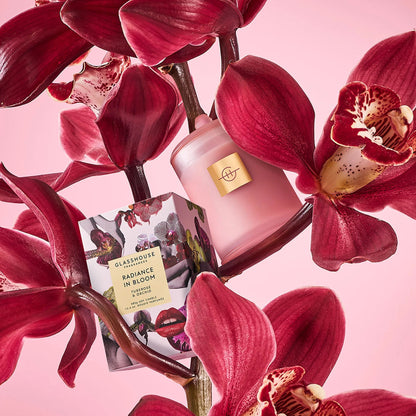 floral stem wrapping around the radiance in bloom candle and the candle box