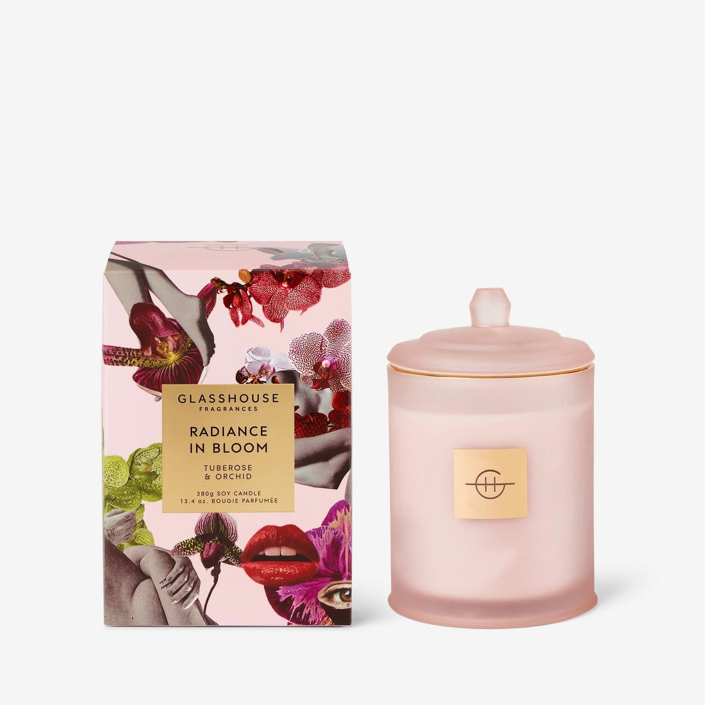 pink radiance in bloom candle next to its floral printed packaging