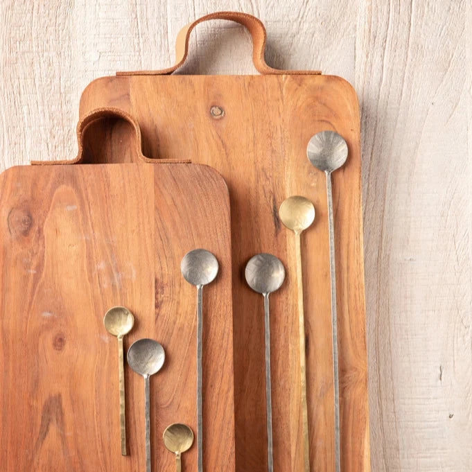 2 sizes of barcelona boards arranged with metal serving spoons.