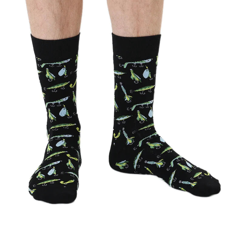 person's feet wearing black socks with all over fishing lure design