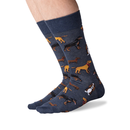 feet wearing denim blue multi dog socks.