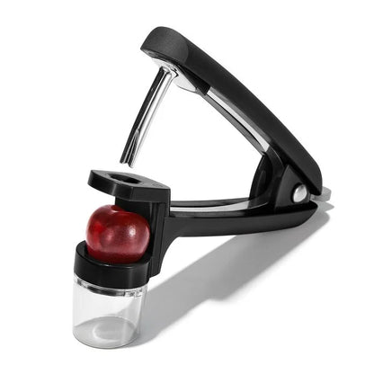 Cherry & Olive Pitter with a cherry in it