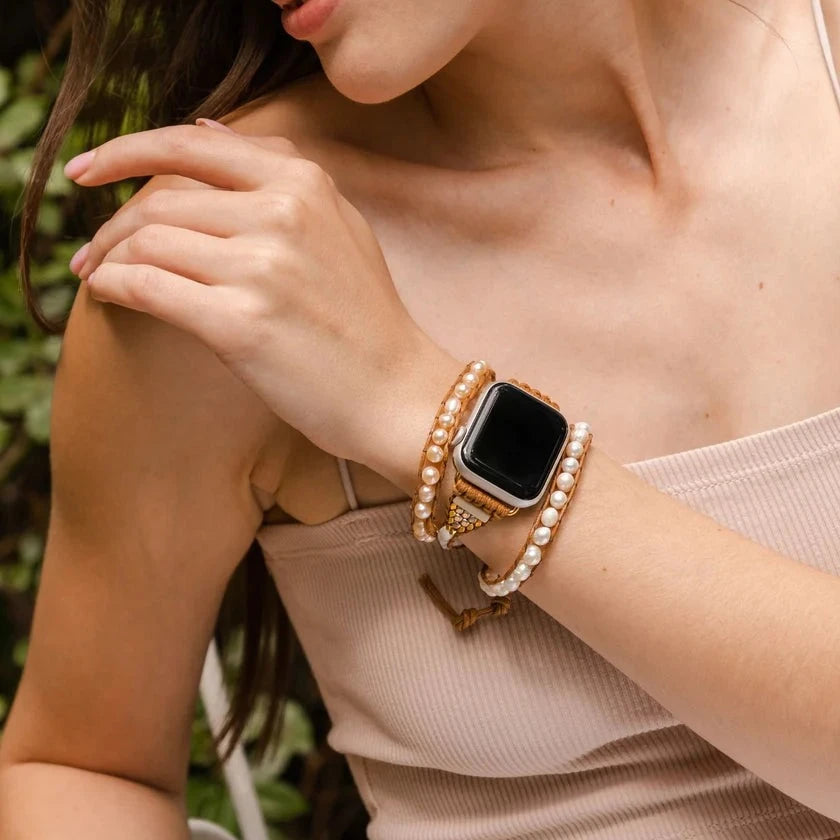 close-up of person wearing Graceful Freshwater Pearl strap on an apple watch.
