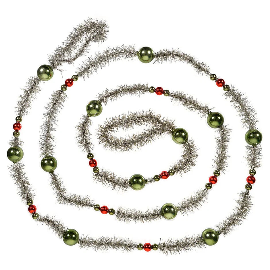 Decorative garland with green beads and silver tinsel swirled on a white background