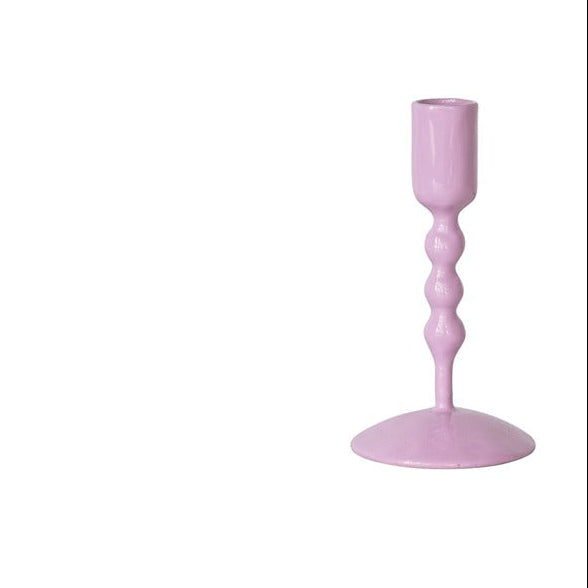 lavender taper candle holder on a white background