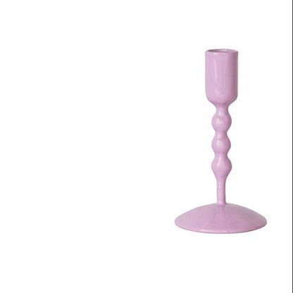 lavender taper candle holder on a white background
