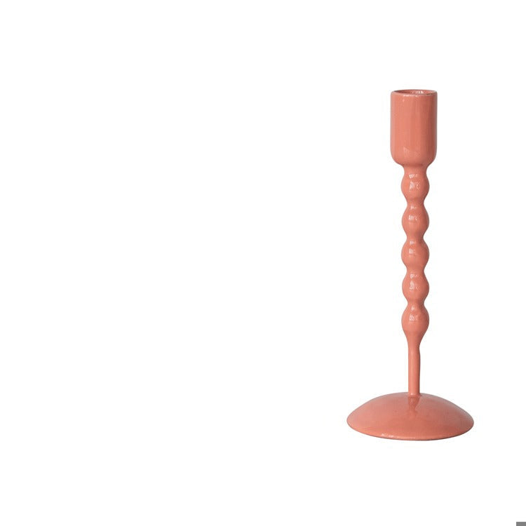 coral pink taper holder shown on a white background