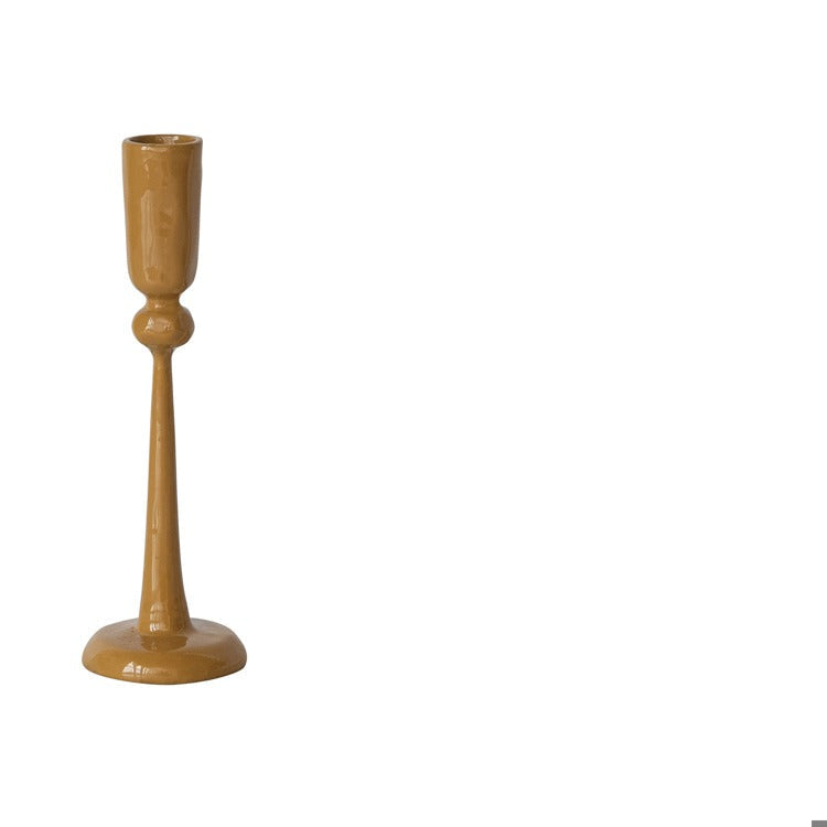 mustard yellow taper holder shown on a white background