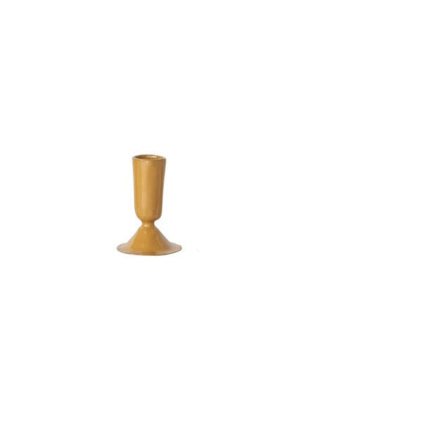small mustard colored taper candle holder on a white background
