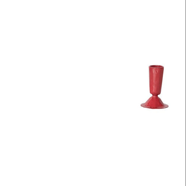 small rosy red  taper candle holder on a white background