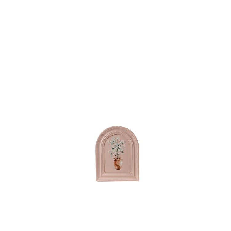 blush pink, arched frame with design of a potted plant painted on it
