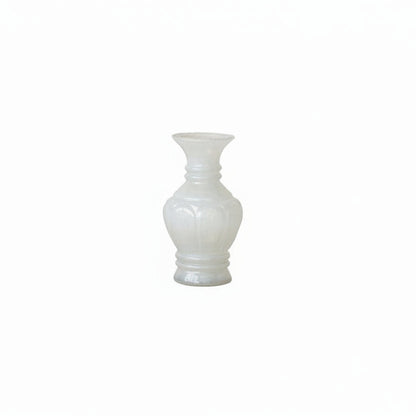 shapely white glass vase on white background
