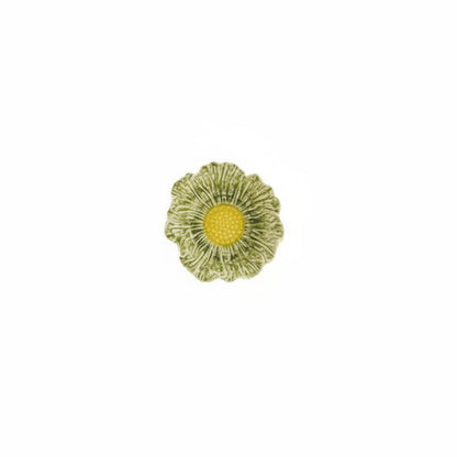 green flower shaped bowl with yellow center