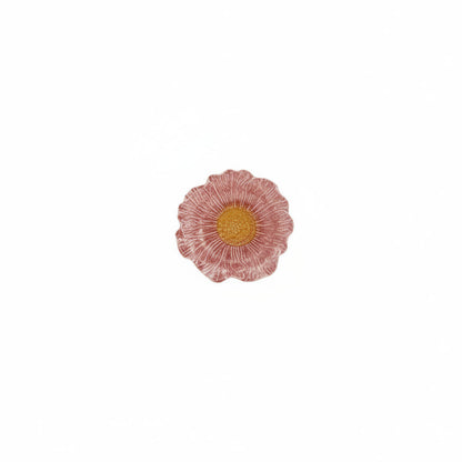 dark pink flower shaped bowl with orange center