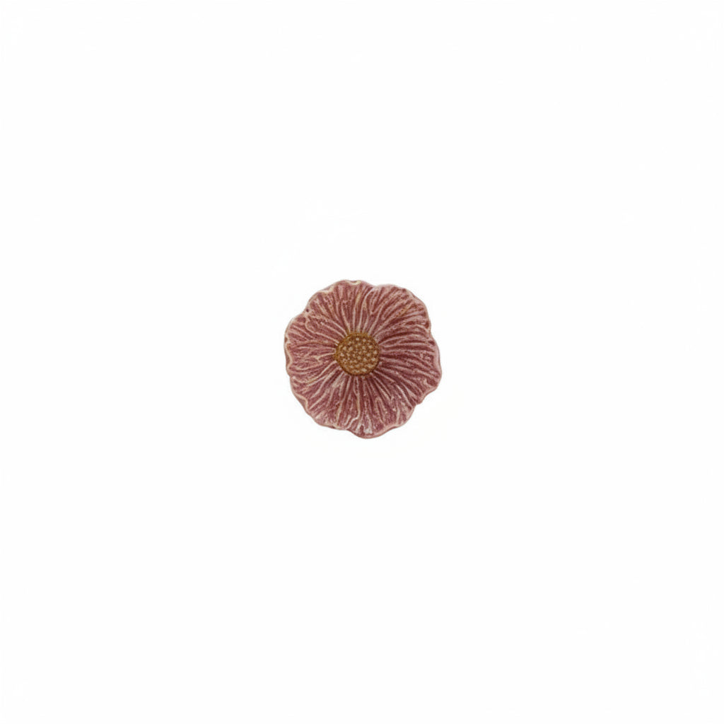 dark pink flower shaped bowl with orange center