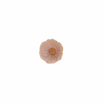 pink flower shaped bowl with bright orange center