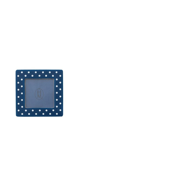 blue frame with white polka dots shown on a white background