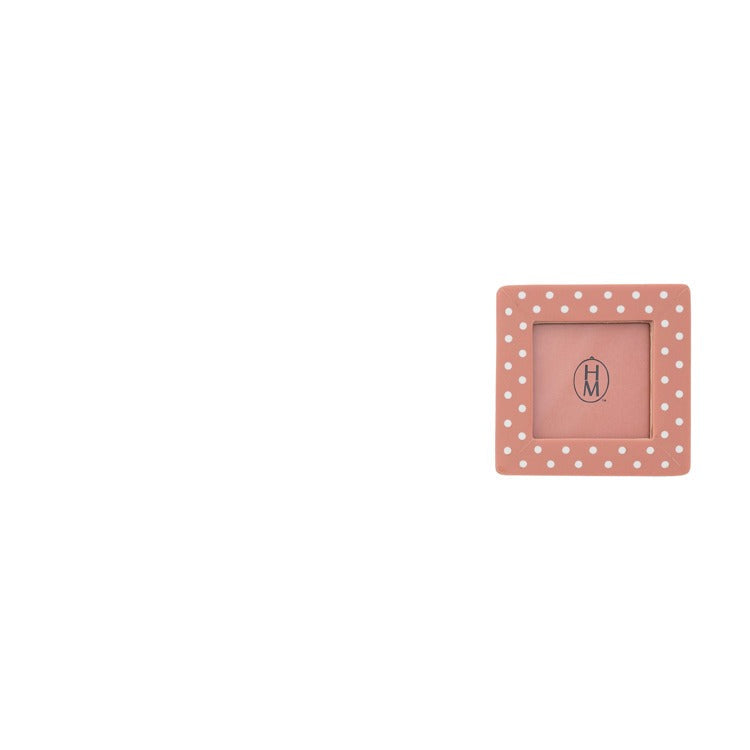 pink frame with white polka dots shown on a white background