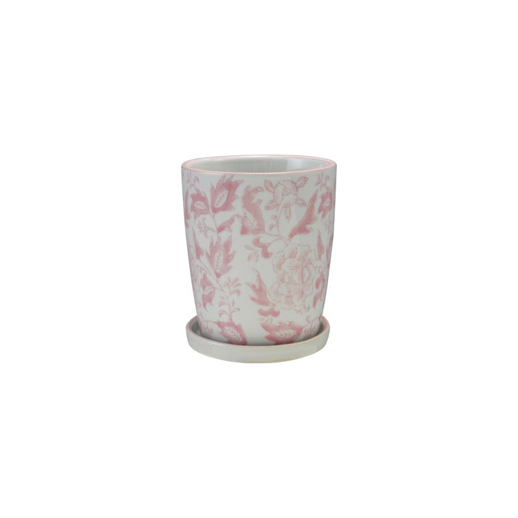 pink and white floral planter with white saucer shown on a white background