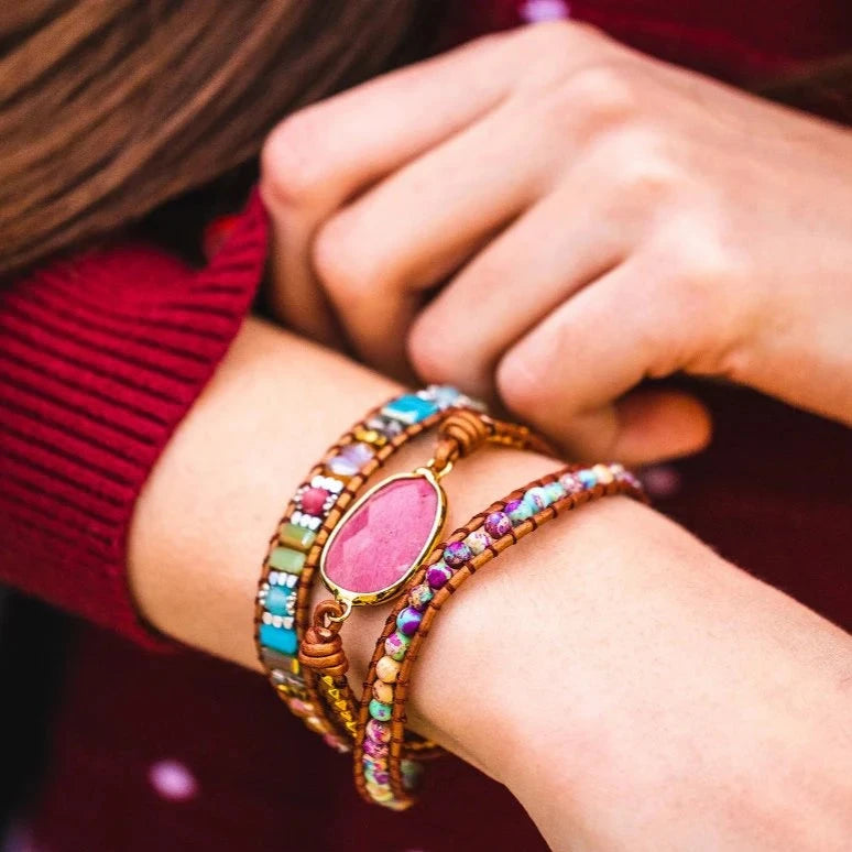 close-up of person's wrist wearing Healing Rhodochrosite wrap bracelet.