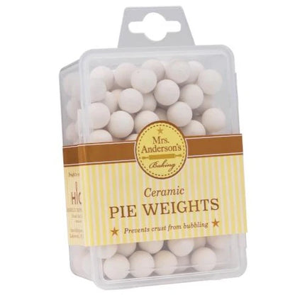 plastic case willed with white ceramic pie weight beads surrounded by the packaging