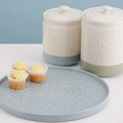 chicken design tray with cupcakes on it and canisters in the background