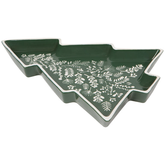 A green, tree-shaped stoneware serving tray with a white greenery pattern.