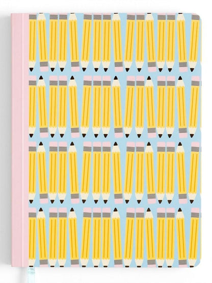 Notebook with yellow pencil pattern on a light blue background