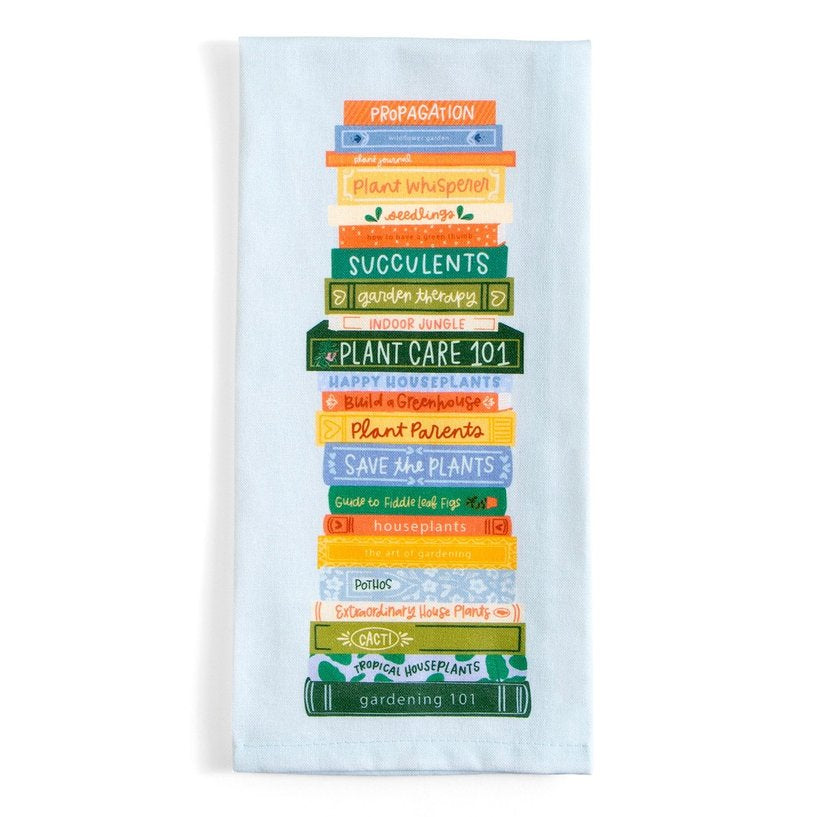 light blue towel with colorful plant book stack printed on it