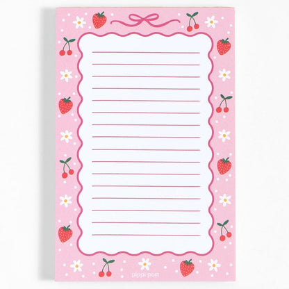 berries and bows notepad on a white background