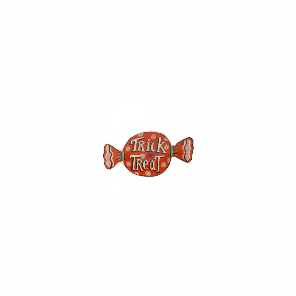 orange candy shaped small dish with "trick or treat" printed on it