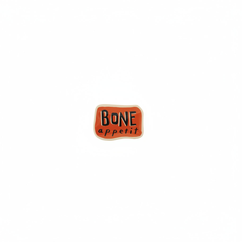 rectangle orange trinket tray with "bone appetit" printed on it in black shown on a white background
